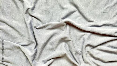 wrinkled gray fabric folds texture abstract closeup soft drapery waves minimalist neutral tones serene composition