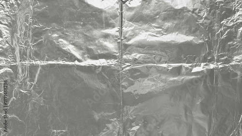 crumpled aluminum foil texture with soft reflections minimalist metallic background flat lay