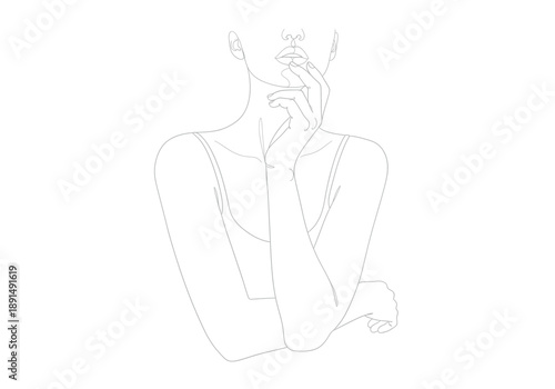 Woman applying perfume to her neck