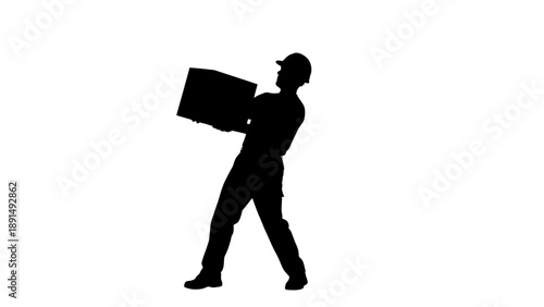 Silhouette of a construction worker carrying a heavy box.