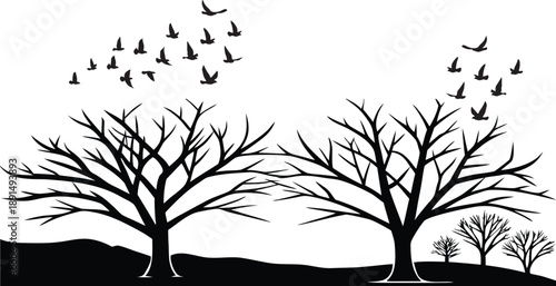 Black silhouette of two large bare trees with flocks of birds flying above