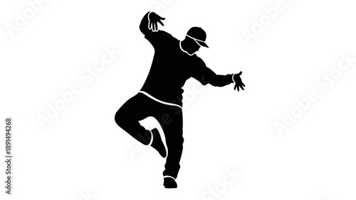 Silhouette of a man dancing hip hop with dynamic movement.