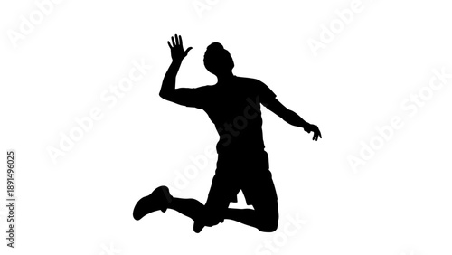Silhouette of a man jumping to hit a volleyball.