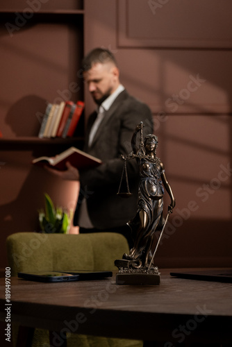 Lady Justice statue placed on a lawyer’s desk in an office, reflecting everyday legal practice and the principles of justice. Concept law, justice, legal profession, office.
