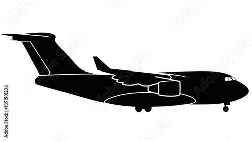 Silhouette of a large cargo airplane in flight.