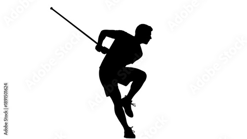Silhouette of a male pole vaulter in mid-air during a jump.