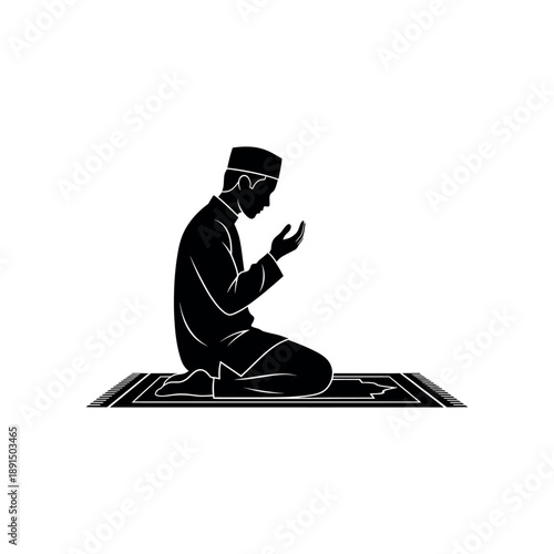 Man praying in Islamic prayer on a mat in black silhouette