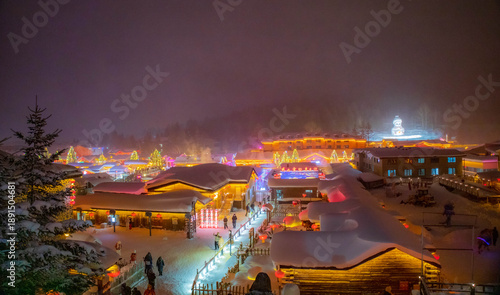 Snowy winter festival night market at Xuexiang China snow town. Dream home, Harbin.