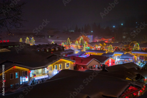 Snowy winter festival night market at Xuexiang China snow town. Dream home, Harbin.