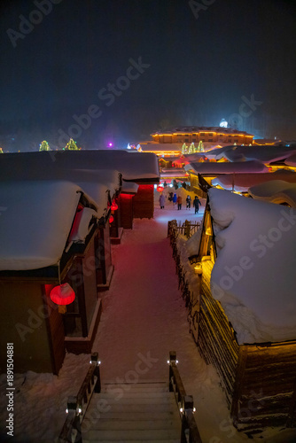 Snowy winter festival night market at Xuexiang China snow town. Dream home, Harbin.