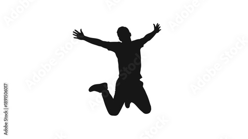 Silhouette of a man jumping with arms raised in celebration.