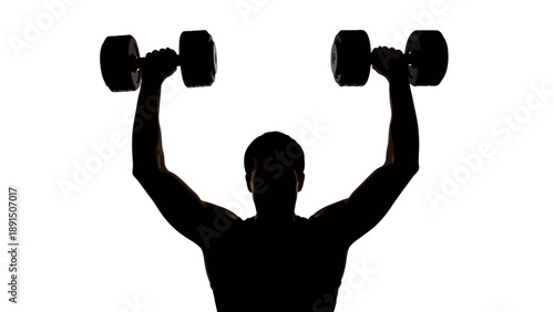Silhouette of a man lifting dumbbells overhead.