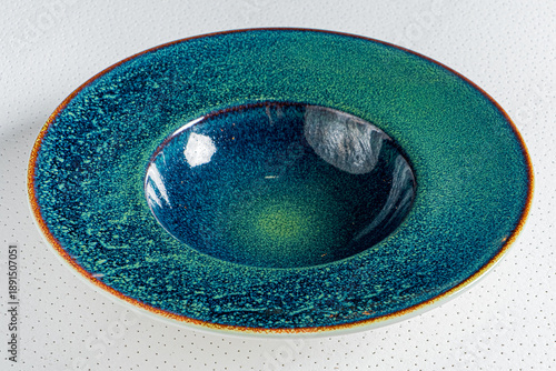 This beautiful ceramic bowl showcases deep blue and green colors in a captivating design © Maksim Shebeko