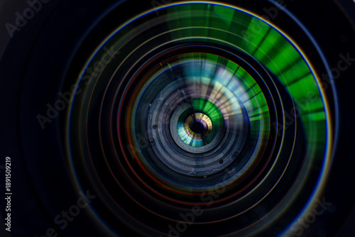 Fotografi Close-up of a Professional 16-35mm Wide-Angle Camera Lens,A detailed, front-facing macro shot of a 16-35mm wide-angle camera lens, highlighting the intricate multi-coated glass elements, internal