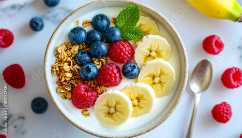 fresh fruit bowl with berries banana granola healthy breakfast
