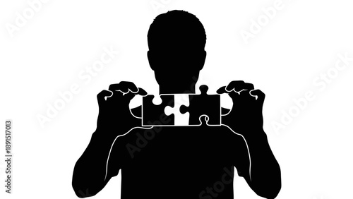 Silhouette of a person holding two puzzle pieces together.