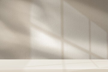 Beige background,Minimal wall with soft natural light shadow from window and empty podium for product backdrop display,cosmetic mocku.Light brown vibes in room,aesthetic background template mock up 