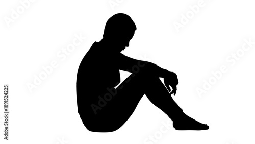 Silhouette of a Seated Person in Deep Thought.