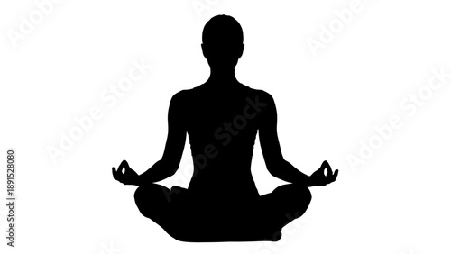 Silhouette of a person in lotus position meditating peacefully.