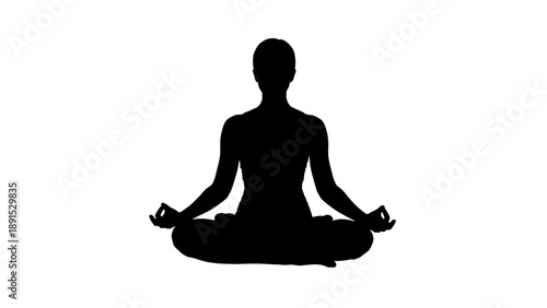 Silhouette of a person meditating in a peaceful lotus pose.