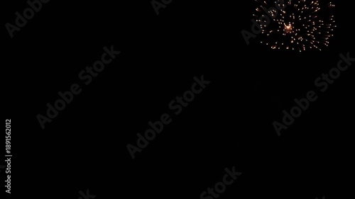 Night sky lit up with bright fireworks, creating a vibrant display of color and celebration. Perfect for themes of festivity, holiday, and joy