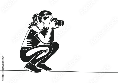 Continuous line art illustration of a female photographer crouching to capture a shot