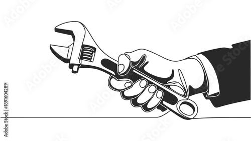 A person's hand firmly gripping an adjustable wrench, ready to perform a repair or adjustment