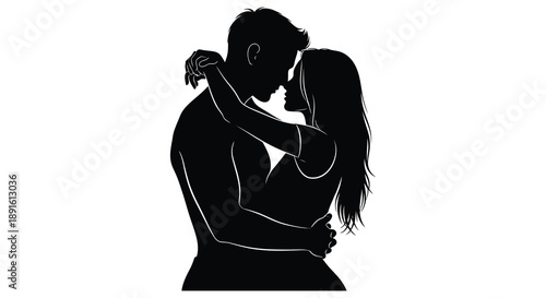 A tender moment is captured as a couple embraces in a close intimate pose presented as a striking silhouette