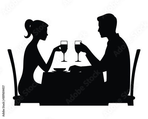 A romantic couple enjoying a wine toast at a dinner table
