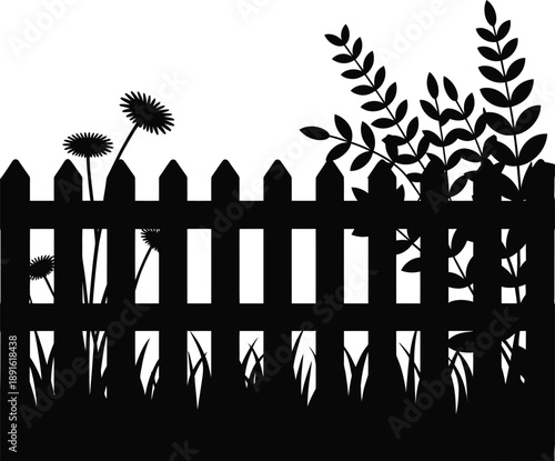 Black silhouette of picket fence with garden flowers and foliage