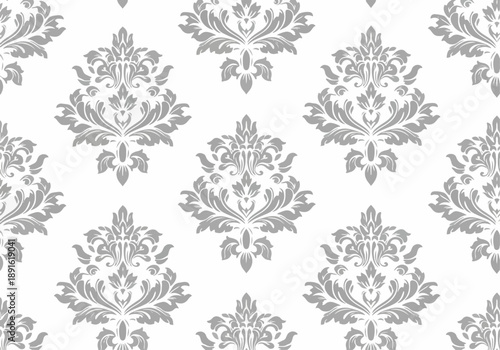 Seamless floral design featuring vibrant tulip motifs and intricate leaf patterns, enclosed in a traditional frame for use in textile backgrounds, fabric prints, and classic decorative patterns.