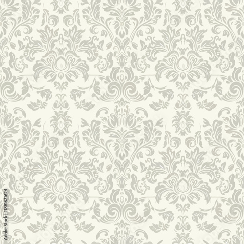 Ornate Seamless pattern. Lace damask background with dense swirls in beige color for invitations, textiles, wallpapers. Monochrome classic backdrop.