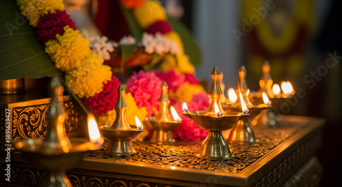 Maha Shivaratri, Hindu devotees praying inside a temple decorated with oil lamps and brightly colored flowers.