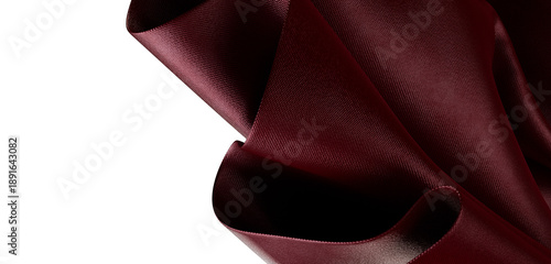Close-up shot of luxurious maroon fabric, showcasing texture and folds. Perfect for design projects, textiles, and artis