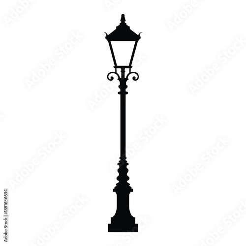 A solitary black silhouette of a vintage street lamp post