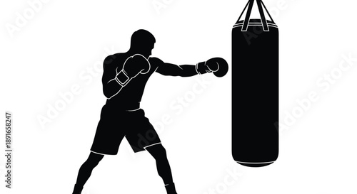Silhouette of a boxer practicing a punch on a heavy bag