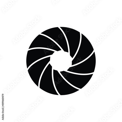 A black and white circular image resembling a camera aperture