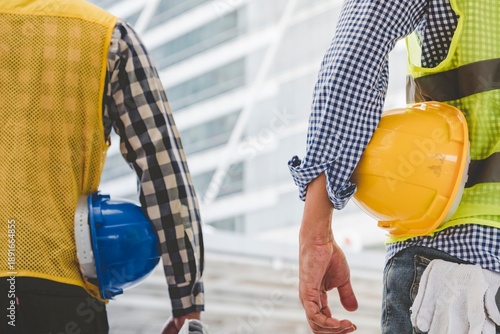 Quadro su tela Group of construction engineer look at blueprint architecture building contractor design in modern city