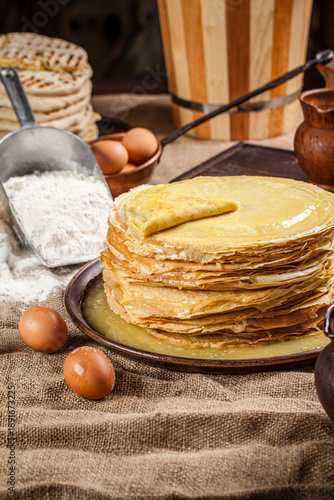 Traditional thin pancake stack with butter