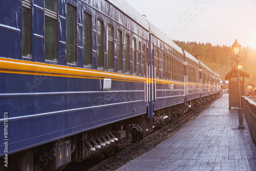 Train stands by the platform at early morning.