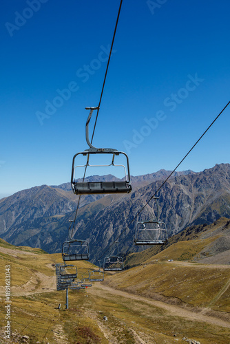 Almaty, Kazakhstan ski lift, cable car cabin at Medeo to Shymbulak route against mountain background
