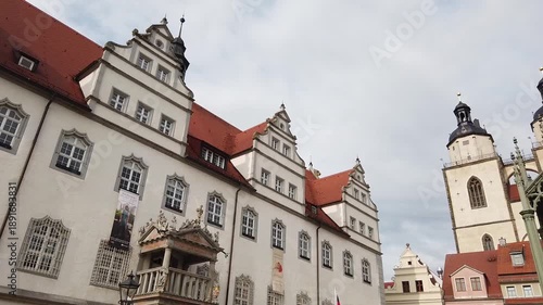 Historic market square of Wittenberg in Germany with town hall, church and Martin Luther statue