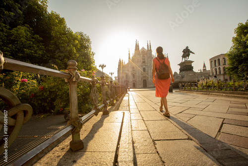 Young woman strolls past Du...