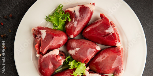 Obraz na plátně Turkey heart offal meat tasty snack fresh delicious gourmet food background on t