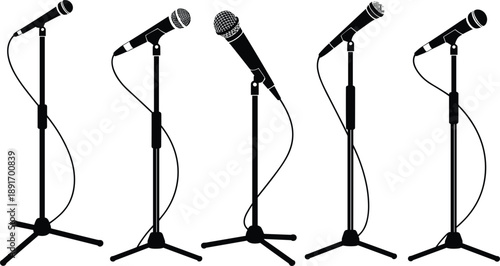 Five black silhouette microphones on adjustable stands with cables on a white background Keywords: microphone, mic, audio, sound