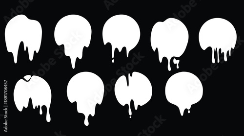 White dripping paint shapes on black background in silhouette style. Liquid drip blobs and melting splashes for creative design. Abstract fluid elements for modern graphic projects.