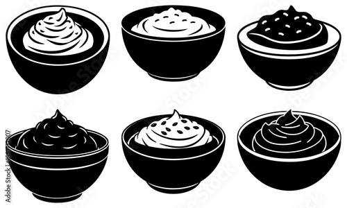 Six black and white bowls of various desserts are arranged.
