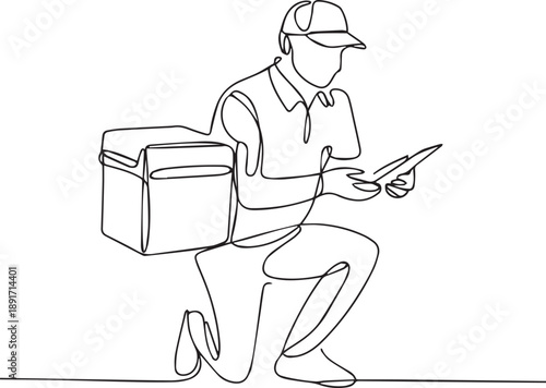 Delivery person checking package on device while kneeling with insulated bag