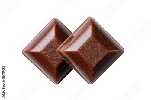 Two diamond-shaped chocolate squares, close-up