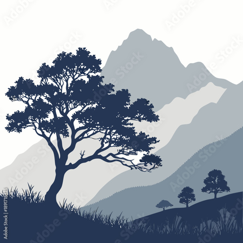 Silhouetted tree in mountainous landscape